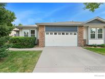 House exterior with two-car garage and landscaping at 3106 Depo Dr, Longmont, CO 80503