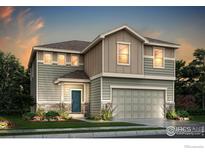 Two-story house with a neutral color scheme and landscaped front yard at 787 Griffith St, Lochbuie, CO 80603