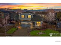 Two-story house with mountain views and landscaped yard at 2062 Indian Paintbrush Way, Erie, CO 80516