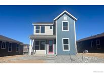 Charming two-story home with blue accents and modern design elements at 2303 Peregrine Dr, Brighton, CO 80601