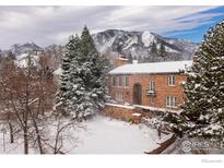 Snow covered home with mountain views at 707 14Th St, Boulder, CO 80302