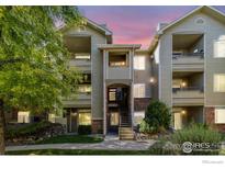 Well-maintained multi-unit building with inviting landscaping at 8400 S Upham Way # E5, Littleton, CO 80128