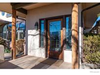 Inviting front door entrance with wood accents and sidelights at 1865 Upland Ave, Boulder, CO 80304