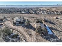 Aerial view of a house with mountain views and expansive property at 2550 175Th Ave, Erie, CO 80516