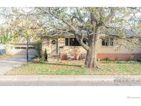 Ranch style home with mature tree and inviting front porch at 2870 15Th St, Boulder, CO 80304