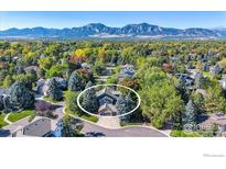 Aerial view of house showcasing surrounding landscape and mountain views at 6345 Swallow Ln, Boulder, CO 80303