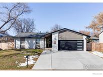 Ranch style home with modern updates, attached garage, and landscaped yard at 8193 Flower Ct, Arvada, CO 80005