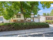 Ranch style home with landscaped yard and attached garage at 840 W Linden St, Louisville, CO 80027