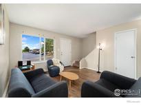 Bright living room with comfy seating and a view at 8778 Mariposa St, Thornton, CO 80260