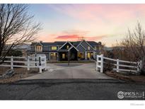 Stunning two-story home with a gated entrance and mountain views at 7401 Deerfield Rd, Longmont, CO 80503