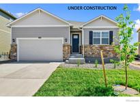 Newly constructed ranch home with stone accents and a two-car garage at 2237 Crosswind St, Fort Lupton, CO 80621