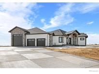Stunning ranch home with three-car garage and expansive driveway at 30410 E 161St Ave, Brighton, CO 80603