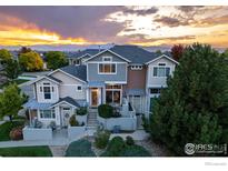 Stunning three-story townhome with mountain views at sunset at 4220 Riley Dr, Longmont, CO 80503