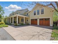 Charming two-story home with a welcoming front porch and two-car garage at 1430 Balsam Ave, Boulder, CO 80304