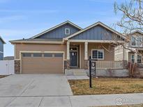 Attractive two-story house with a two-car garage and landscaped yard at 2321 Nicholson St, Berthoud, CO 80513