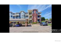 Brick and blue multi-unit building with parking at 2428 W 82Nd Pl # 2A, Westminster, CO 80031