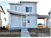 Two-story house with gray siding and a covered entryway, under construction at 517 Hillsview Dr, Berthoud, CO 80513