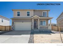 New two-story house with attached garage and front porch at 6531 13Th St, Frederick, CO 80530