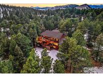 Luxury mountain home nestled in a wooded area with mountain views at 133 Mine Ln, Boulder, CO 80302