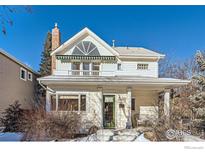 Charming two-story home with a green door and landscaped yard at 1841 Columbine Ave, Boulder, CO 80302