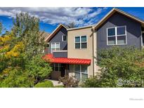 Two-story modern home with red roof and gray siding at 3255 Ouray St, Boulder, CO 80301