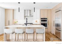 Modern kitchen with light wood cabinets, white countertops, and island at 3560 16Th St, Boulder, CO 80304