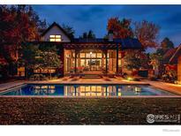 Luxury home with a stunning pool and patio at night at 3621 21St St, Boulder, CO 80304