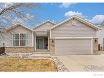 Nice two-story house with a two-car garage and well-maintained lawn at 11661 Kearney Way, Thornton, CO 80233