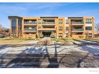 Modern condo building with brick facade and balconies at 2801 Pennsylvania Ave # 201, Boulder, CO 80303