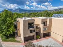 Modern stucco condo with a two-car garage and mountain views at 3805 Northbrook Dr # A, Boulder, CO 80304