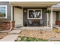 Inviting front porch with seating area, creating a welcoming entrance to the home at 51 21St Ave # 30, Longmont, CO 80501