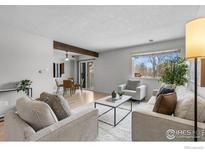 Bright living room with a dining area, large windows, and modern decor at 1170 Monroe Dr # C, Boulder, CO 80303