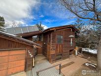 Wooden exterior of house with solar panels and walkway at 1743 Hawthorn Pl, Boulder, CO 80304