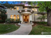 Elegant two-story home with a grand entrance and landscaped grounds at 2210 Meadow Ave, Boulder, CO 80304