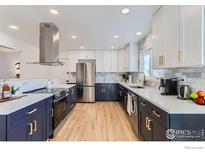 Renovated kitchen with modern cabinetry, quartz countertops, and stainless steel appliances at 3000 Dartmouth Ave, Boulder, CO 80305