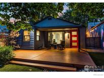 Charming bungalow with a red door, deck, and landscaped yard at 2345 South St, Boulder, CO 80302