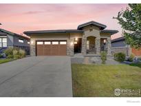 Craftsman style home with a two-car garage and landscaped front yard at 365 Casalon Pl, Superior, CO 80027