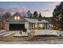 Updated ranch home with modern facade, landscaping, and snowy yard at 5166 Forsythe Pl, Boulder, CO 80303