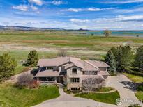 Luxury home with scenic views, expansive grounds, and a large driveway at 5277 Westridge Dr, Boulder, CO 80301