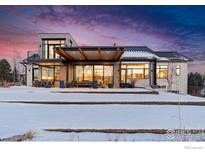 Stunning modern home with mountain views, expansive windows, and a covered patio at 635 Paragon Dr, Boulder, CO 80303