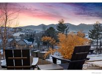 Inviting outdoor seating area showcasing panoramic mountain views at sunset at 635 Paragon Dr, Boulder, CO 80303