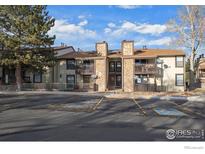 Attractive exterior of a condo building with parking at 7820 W 87Th Dr # K, Arvada, CO 80005