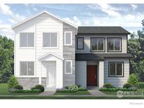 Two-story home with gray and white exterior, stone accents, and landscaping at 1434 Coral Pl, Longmont, CO 80504