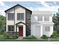 Two-story home with stone accents and landscaped front yard at 1438 Coral Pl, Longmont, CO 80504