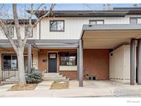 Charming townhome features a covered carport and inviting front entrance at 1521 Bradley Dr, Boulder, CO 80305