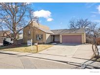 Ranch style home with attached garage and mature landscaping at 2132 Ridge Dr, Broomfield, CO 80020