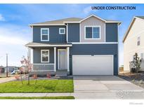 Two-story home with gray siding, white trim, and a two-car garage at 2245 Base St, Fort Lupton, CO 80621