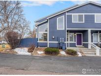 Charming two-story home with unique architectural windows and a lovely purple door at 1183 James Ct # 1, Lafayette, CO 80026