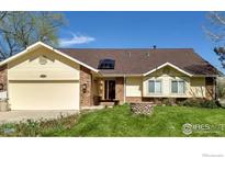 Ranch style home with attached garage and well-maintained landscaping at 12900 N 66Th St, Longmont, CO 80503