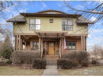 Inviting two-story home with a charming porch and pergola, perfect for relaxing and enjoying the outdoors at 1385 Washburn St, Erie, CO 80516